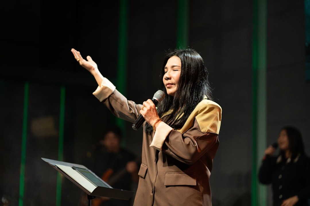 person speaking confidently on stage