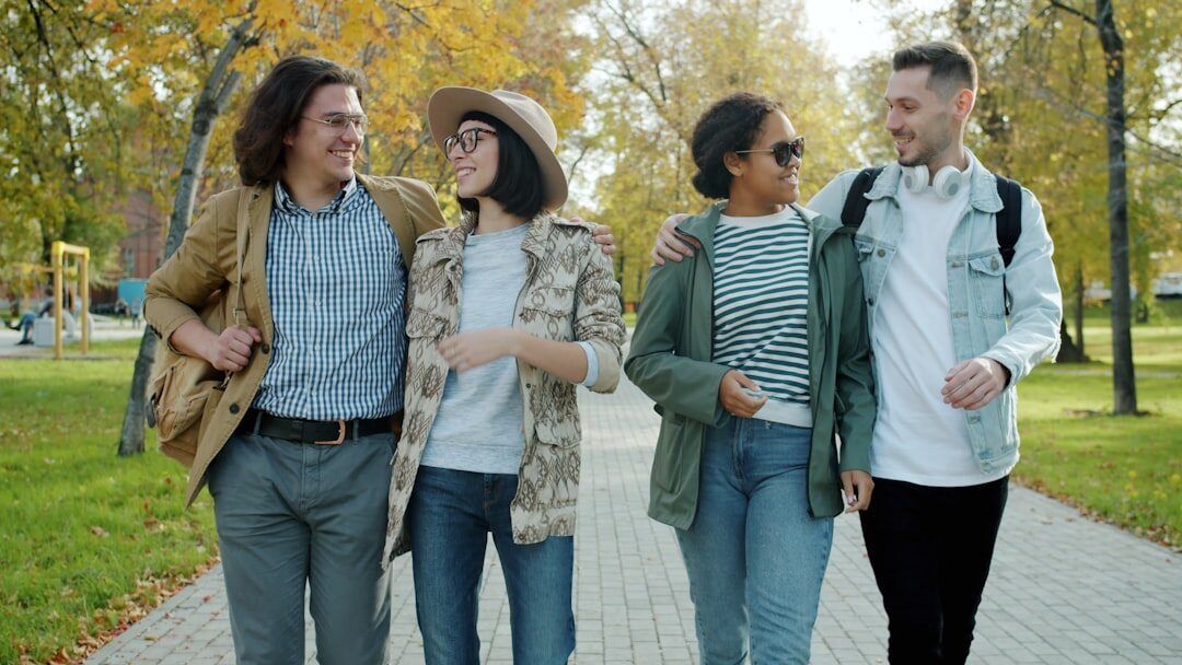 Group of friends having a supportive conversation outdoors